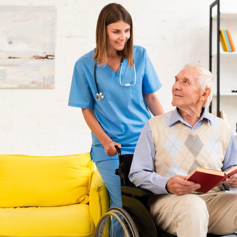 old-man-sitting-wheelchair-while-talking-nurse